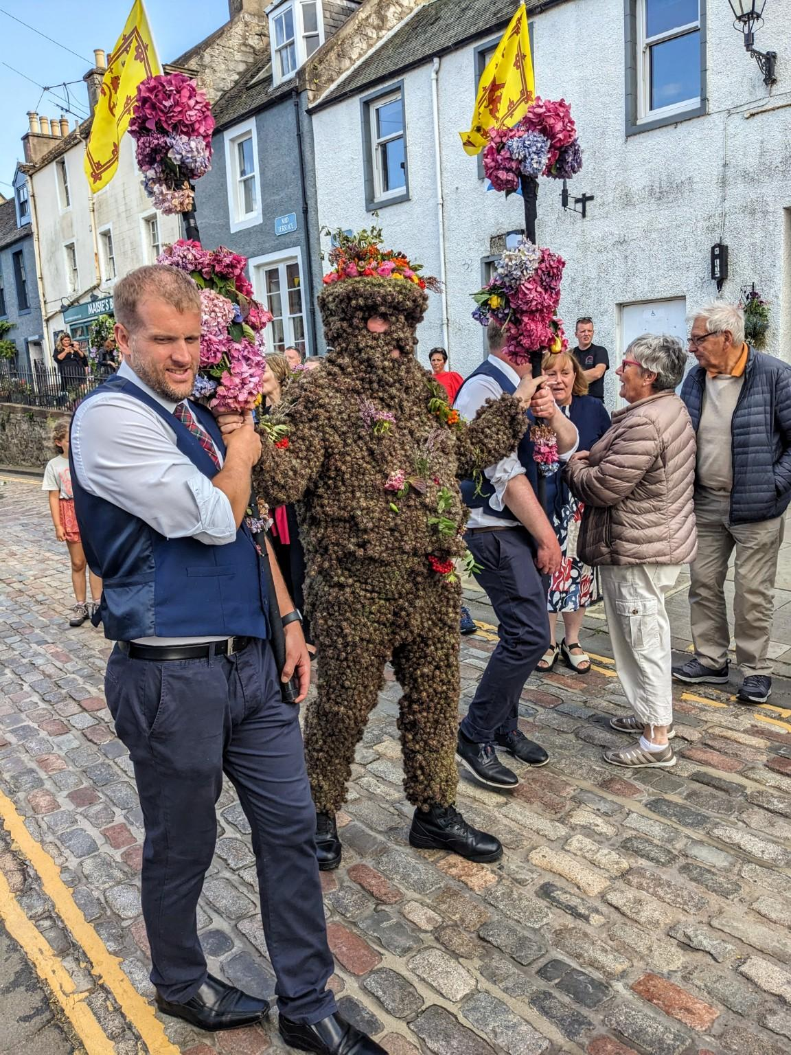 The Burry Man procession passing through South Queensferry High Street