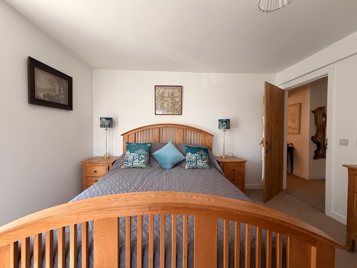 First guest bedroom with a wooden king-size bed